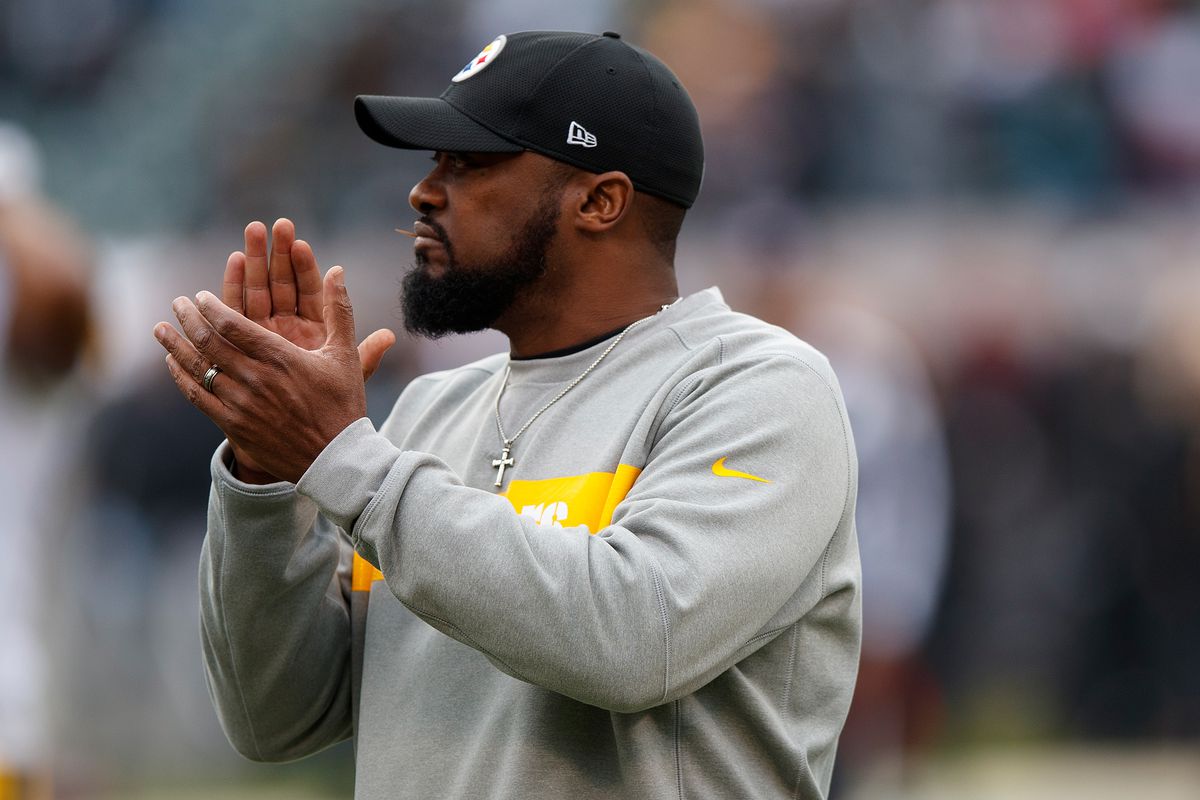 Mike Tomlin wearing a gray sweater and black cap