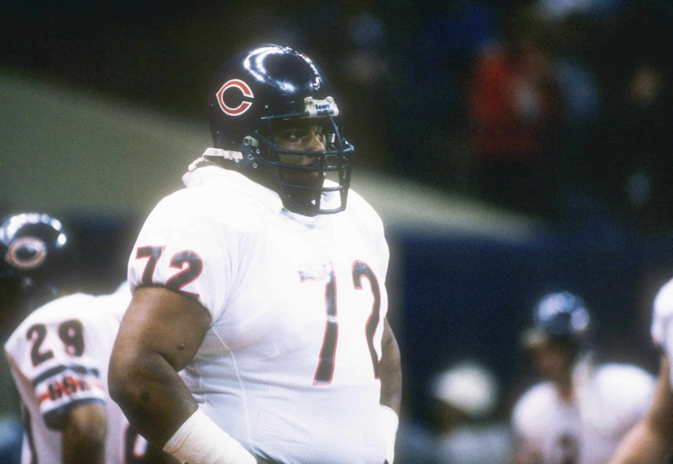 William Perry wearing white football uniform and black helmet