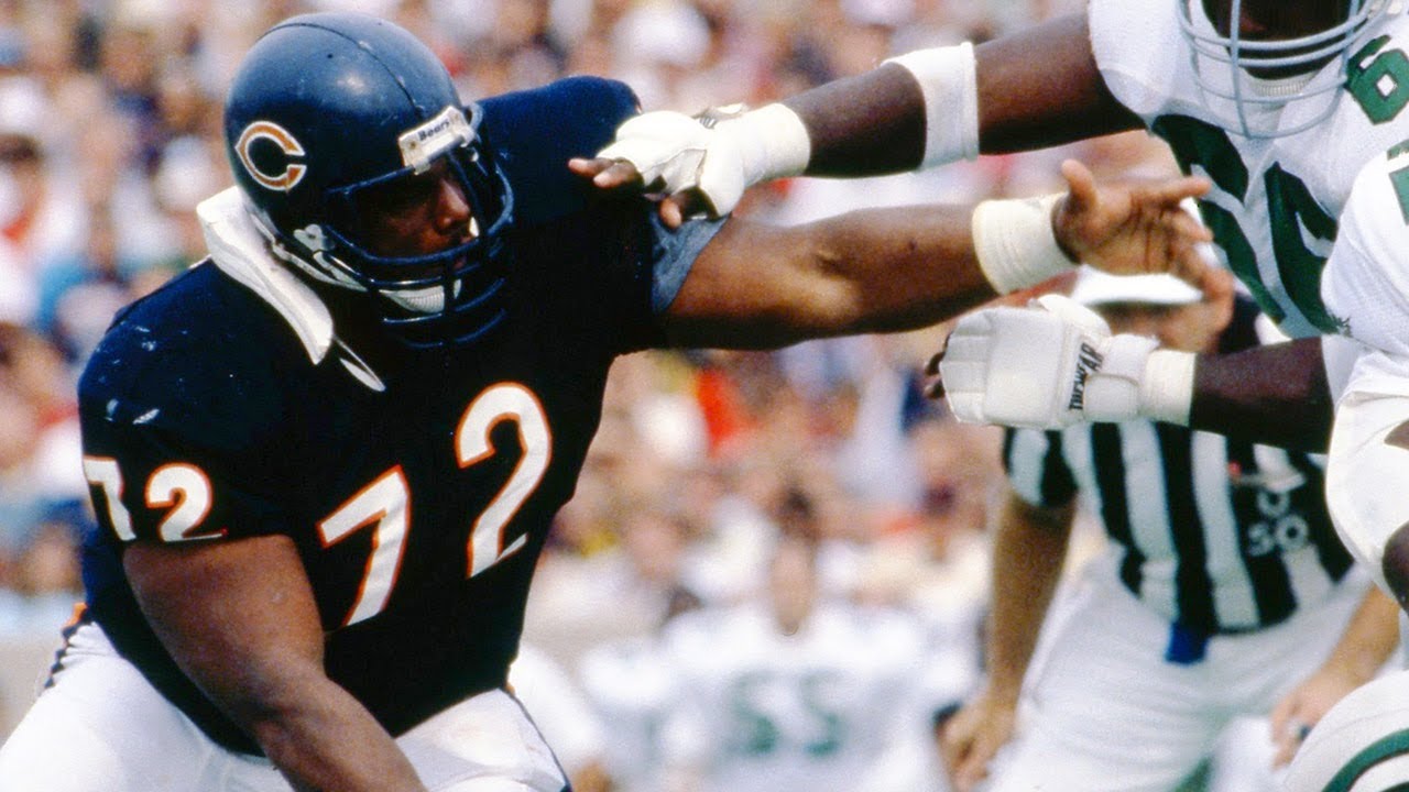 William Perry wearing a blue football jersey and helmet