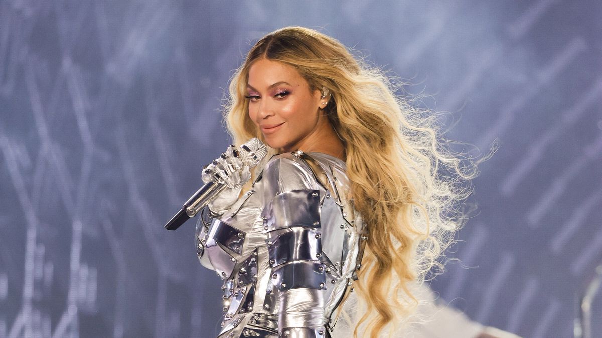 Beyoncé wearing a silver bodysuit