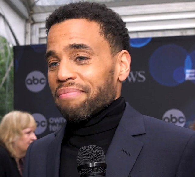 Michael Ealy wearing a blue suit