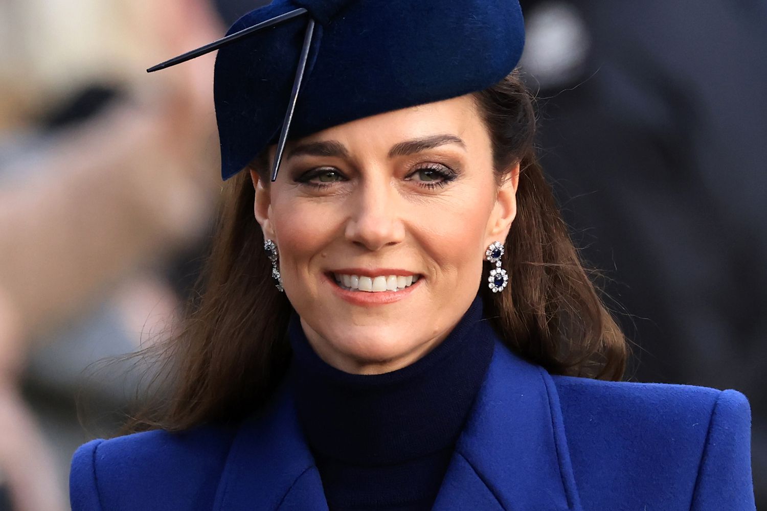 Kate Middleton wearing a blue coat and hat